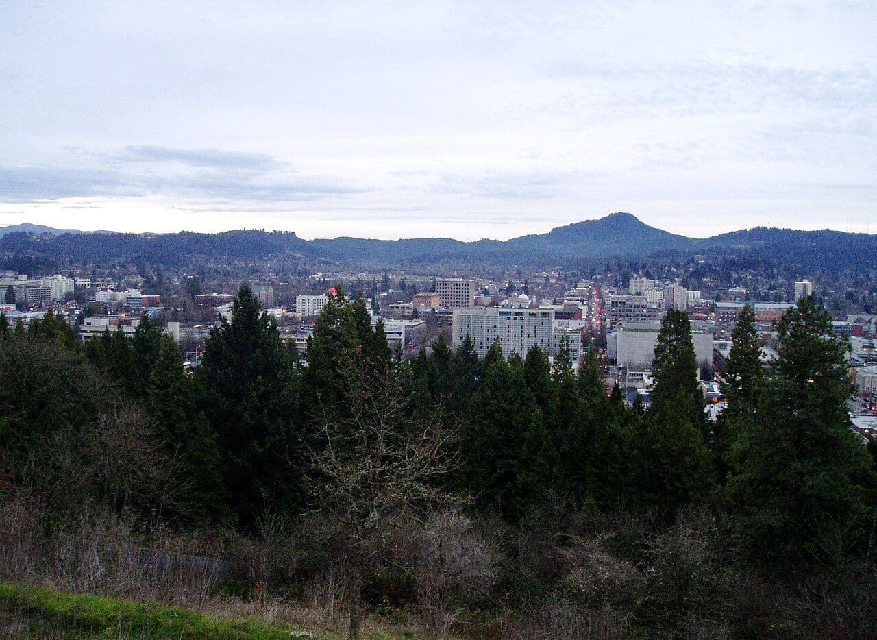 The downtown Eugene skyline with Spencer Butte behind it, seen from Skinner Butte.