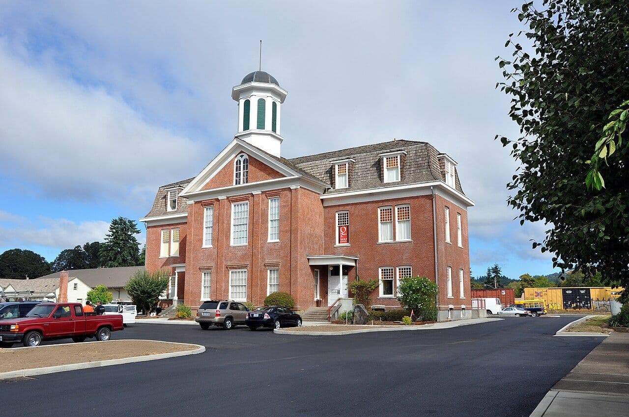 The red-brick Benton County Historical Museum in Philomath, with its white cupola.